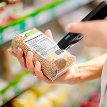 M60 scanning a barcode in a grocery store